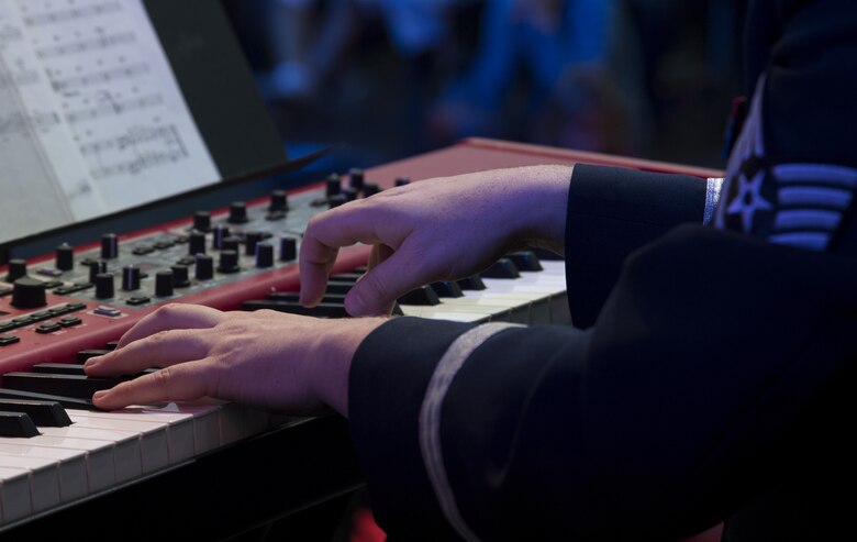 U.S. Air Force Staff Sgt. Justin Cockerham, U.S. Air Forces in Europe jazz band piano, performs for the 73rd anniversary of the Slovak National Uprising in Banská Bystrica, Slovakia, Aug. 29, 2017. The jazz band, known as the Ambassadors, was comprised of 12 Airmen for this performance, to include saxophones, trombones, trumpets, percussion, and bass players. Participating in events with NATO allies improves interoperability and strengthens long standing relationships. (U.S. Air Force photo by Senior Airman Tryphena Mayhugh)