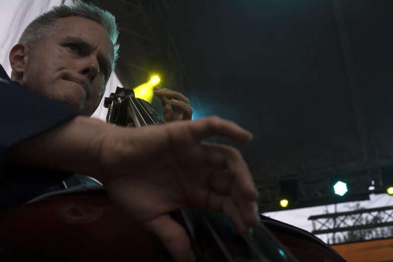 U.S. Air Force Staff Sgt. Joseph Whitt, U.S. Air Forces in Europe jazz band bass, strums the strings of his bass during the band’s performance for the 73rd anniversary of the Slovak National Uprising in Banská Bystrica, Slovakia, Aug. 29, 2017. The USAFE band represents unique international musical heritage, building and preserving partnerships through official multi-national military and international community outreach events. (U.S. Air Force photo by Senior Airman Tryphena Mayhugh)