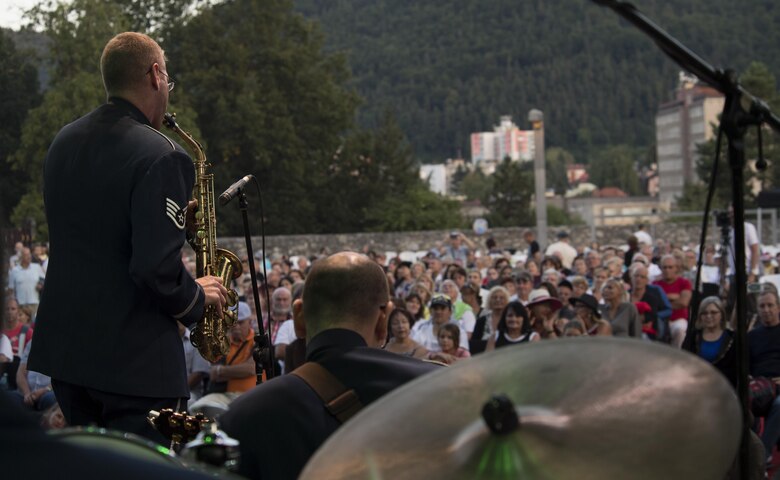 U.S. Air Force Staff Sgt. Brian Connolly, U.S. Air Forces in Europe jazz band saxophone, performs before a crowd with other members of the band for the 73rd anniversary of the Slovak National Uprising in Banská Bystrica, Slovakia, Aug. 29, 2017. U.S. bands are invited each year to perform for the event. Participating in events with NATO allies improves interoperability and strengthens long standing relationships. (U.S. Air Force photo by Senior Airman Tryphena Mayhugh)