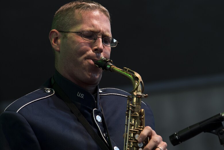 U.S. Air Force Staff Sgt. Brian Connolly, U.S. Air Forces in Europe jazz band saxophone, plays a solo during the band’s performance for the 73rd anniversary of the Slovak National Uprising in Banská Bystrica, Slovakia, Aug. 29, 2017. The USAFE band serves to increase cultural ties and to enhance the people-to-people relationship between the U.S. and Slovakia. (U.S. Air Force photo by Senior Airman Tryphena Mayhugh)