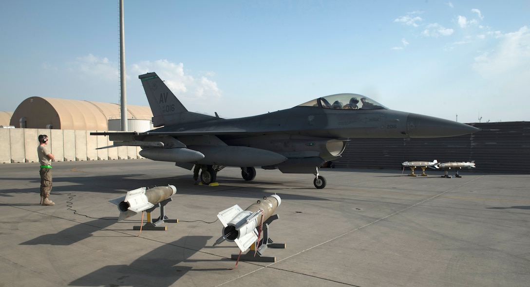 An F-16 Fighting Falcon parks on the flightline at Bagram Airfield