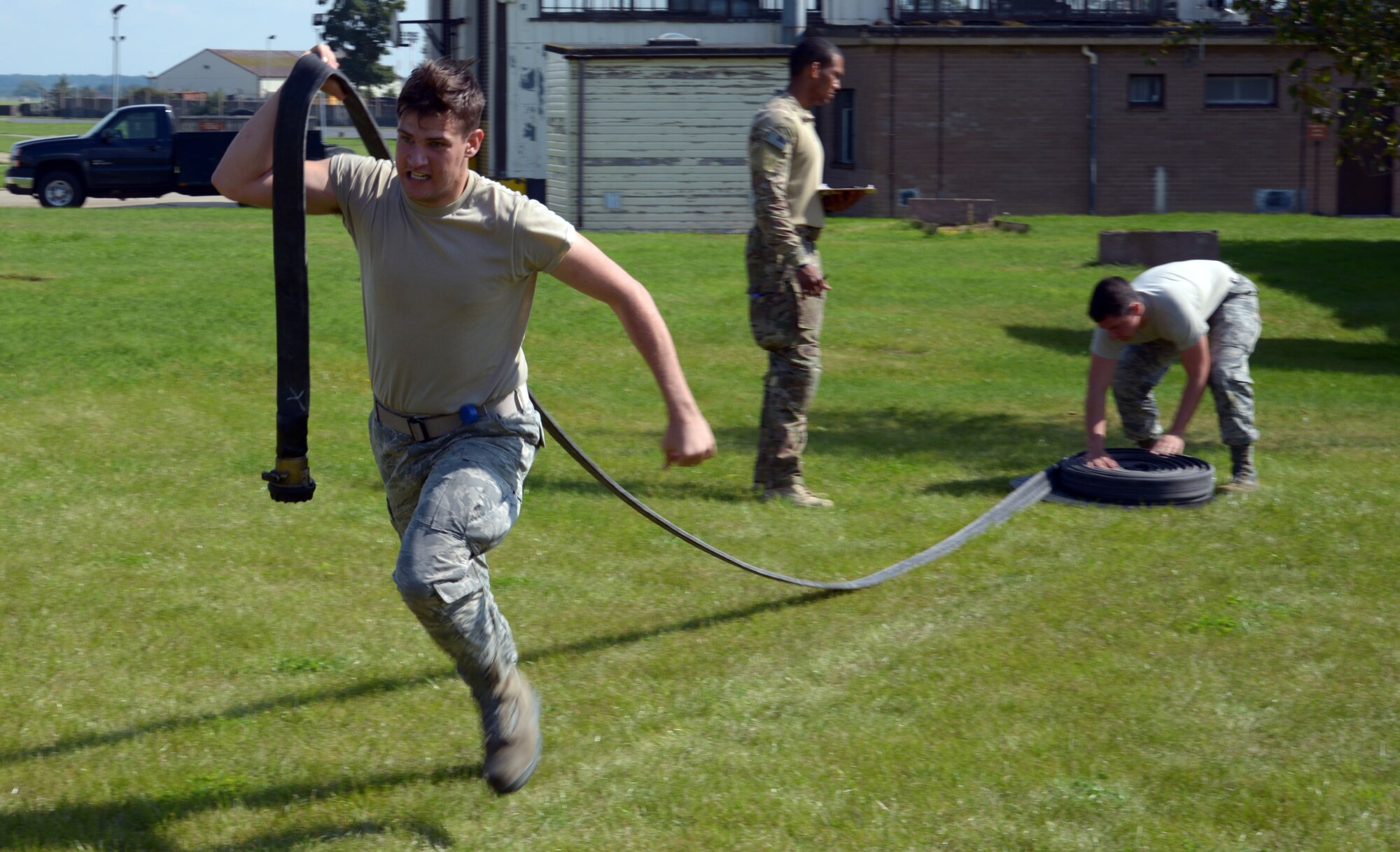 Airman races to carry hose