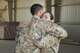 Tech. Sgt. Jason Blunt, 557th RED HORSE craft lead, left, hugs his mom Sgt. Maj. Janet Blunt, U.S. Army Central Forward Command Post G-4 Sgt. Maj. of logistics, during a promotion ceremony Sep. 1, 2017, in Southwest Asia. Both are currently deployed to separate undisclosed locations, but through some coordination Blunt was able surprise her son by attending his promotion ceremony. (U.S. Air Force photo/Senior Airman Damon Kasberg)