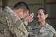 Tech. Sgt. Jason Blunt, 557th RED HORSE craft lead, left, wipes away tears of joy after seeing his mother Sgt. Maj. Janet Blunt, U.S. Army Central Forward Command Post G-4 Sgt. Maj. of logistics, Sep. 1, 2017, in Southwest Asia. Both are currently deployed to separate undisclosed locations, but through some coordination Blunt was able surprise her son by attending his promotion ceremony. (U.S. Air Force photo/Senior Airman Damon Kasberg)