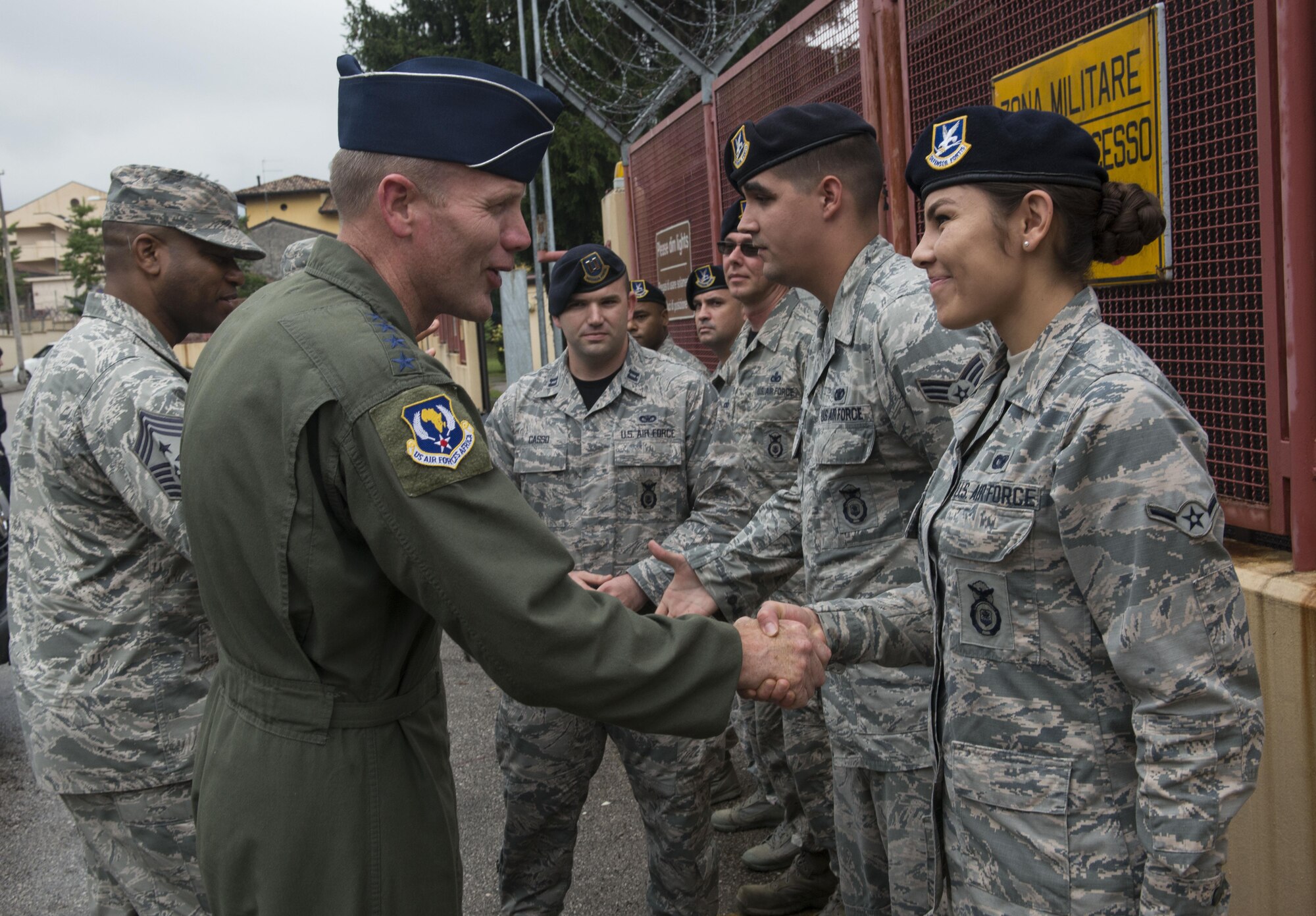 Gen. Tod Wolters, U.S. Air Forces in Europe and Air Forces Africa commander, presents Airman Jacquelyn Harvey, 31st Security Forces Squadron security response team member, with a coin on Sept. 1, 2017, at Aviano Air Base, Italy. During his visit he toured several base facilitates, met with the 31st Fighter Wing leadership and visited Airmen around base. (U.S. Air Force photo by Staff Sgt. Krystal Ardrey)