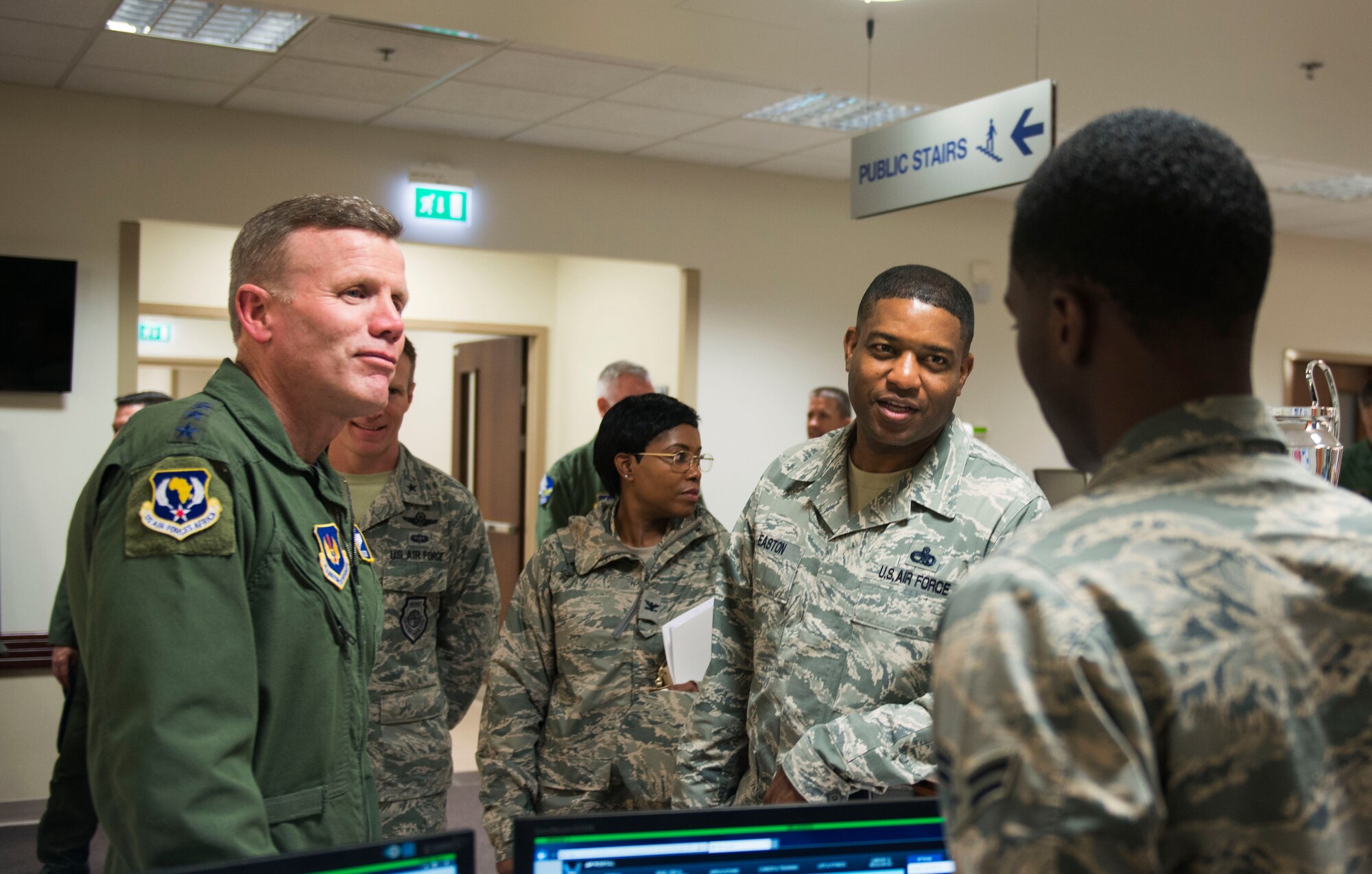 Gen. Tod Wolters, U.S. Air Forces in Europe and Air Forces Africa commander, and Chief Master Sgt. Phillip Easton, USAFE-AFAFRICA command chief, speak with an Airman from the 31st Medical Group on Sept. 1, 2017, at Aviano Air Base, Italy. During his visit he toured several base facilitates, met with wing leadership and visited Airmen. (U.S. Air Force photo by Staff Sgt. Krystal Ardrey)