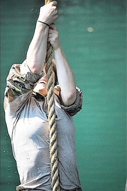 Capt. Kaci Dixon climbs onto a bridge at Yale Reservoir, Wash., in August 2015. She was participating in a training exercise with the 125th Special Tactics Squadron. (Courtesy photo)