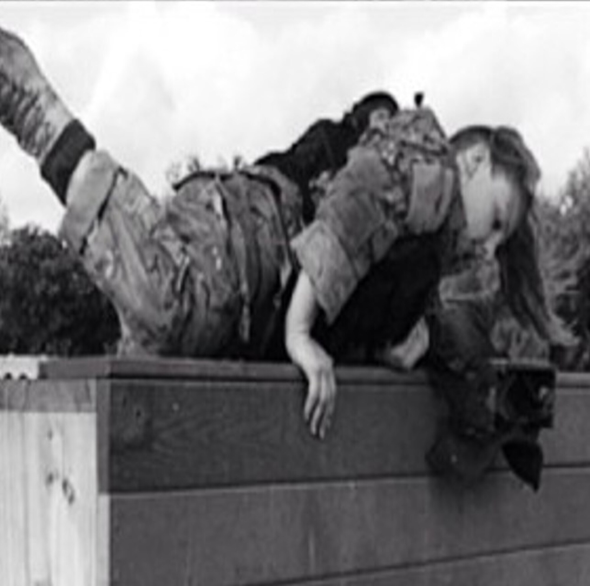 Capt. Kaci Dixon moves through an obstacle course during the Women in Service Review in June 2015 at Lackland Air Force Base, Texas. She was wearing a 30-pound vest and carrying a 90-pound ruck to simulate gear. (Courtesy photo)