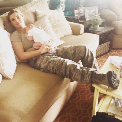 Capt. Kaci Dixon relaxes with her 5-week-old daughter at Hurlburt Field, Fla., Aug. 10, 2017. (Courtesy photo)