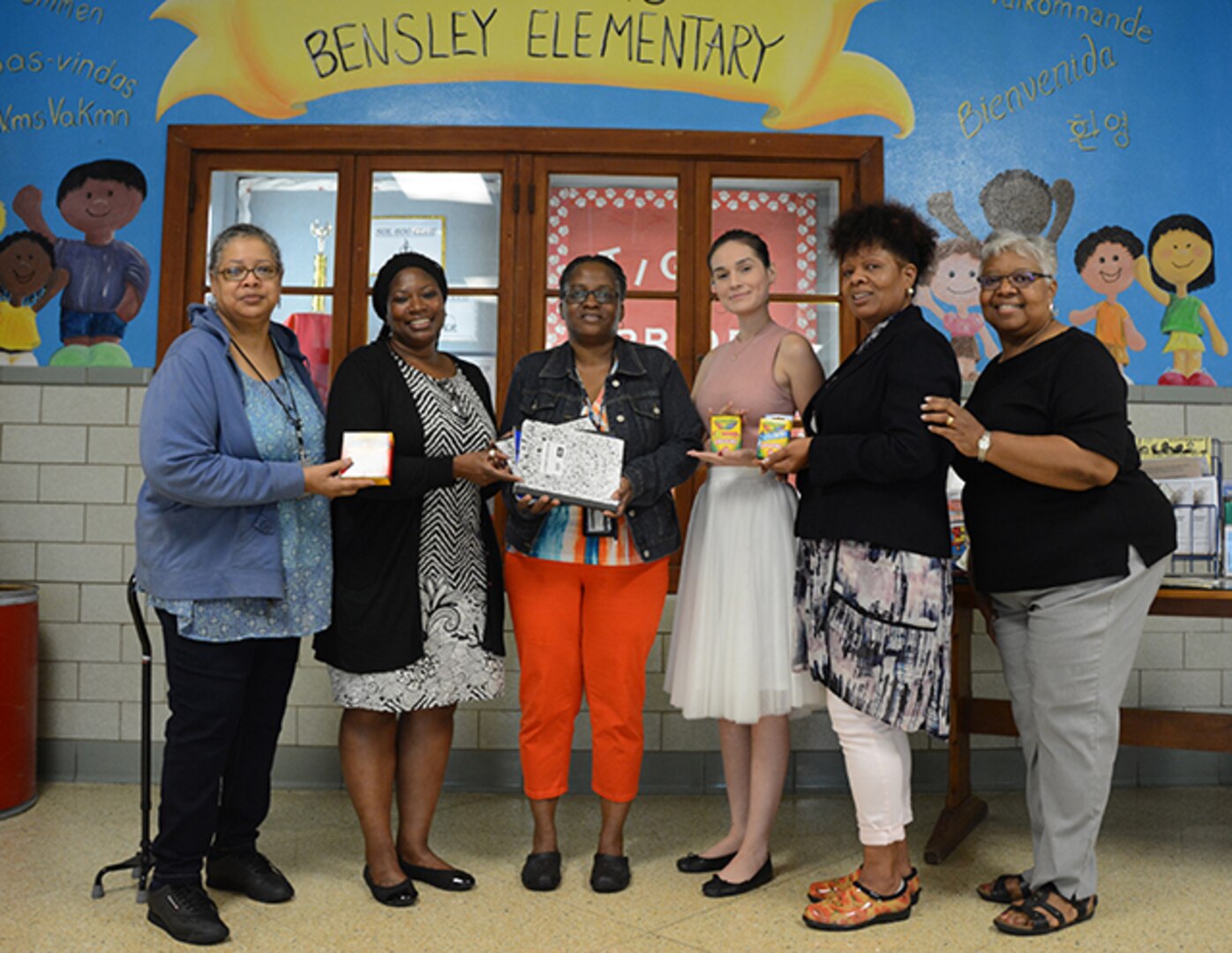 Employees deliver donated school suppliers