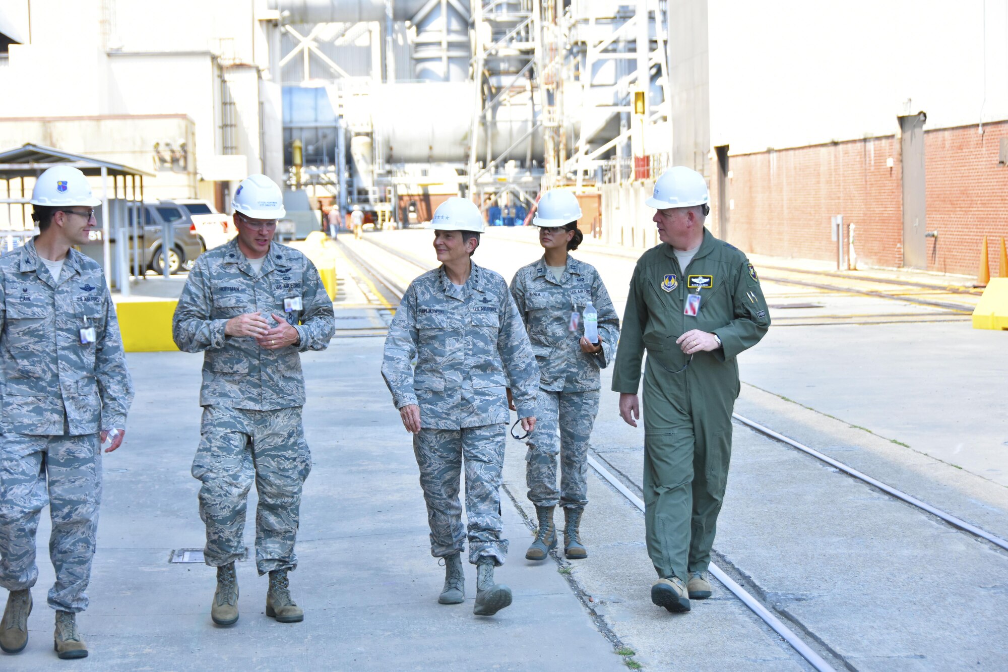 Gen. Ellen M. Pawlikowski, Air Force Materiel Command commander (center); Maj. Gen. David Harris, Air Force Test Center commander (right); and Col. Scott Cain, Arnold Engineering Development Complex commander (left), receive a facility briefing and tour of the Propulsion Wind Tunnels by Lt. Col. David Hoffman (second from left), Flight Systems Combined Test Force director, Aug. 22, 2017. (U.S. Air Force photo/Rick Goodfriend) (This image was manipulated by obscuring badges for security purposes.)
