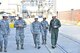 Gen. Ellen M. Pawlikowski, Air Force Materiel Command commander (center); Maj. Gen. David Harris, Air Force Test Center commander (right); and Col. Scott Cain, Arnold Engineering Development Complex commander (left), receive a facility briefing and tour of the Propulsion Wind Tunnels by Lt. Col. David Hoffman (second from left), Flight Systems Combined Test Force director, Aug. 22, 2017. (U.S. Air Force photo/Rick Goodfriend) (This image was manipulated by obscuring badges for security purposes.)