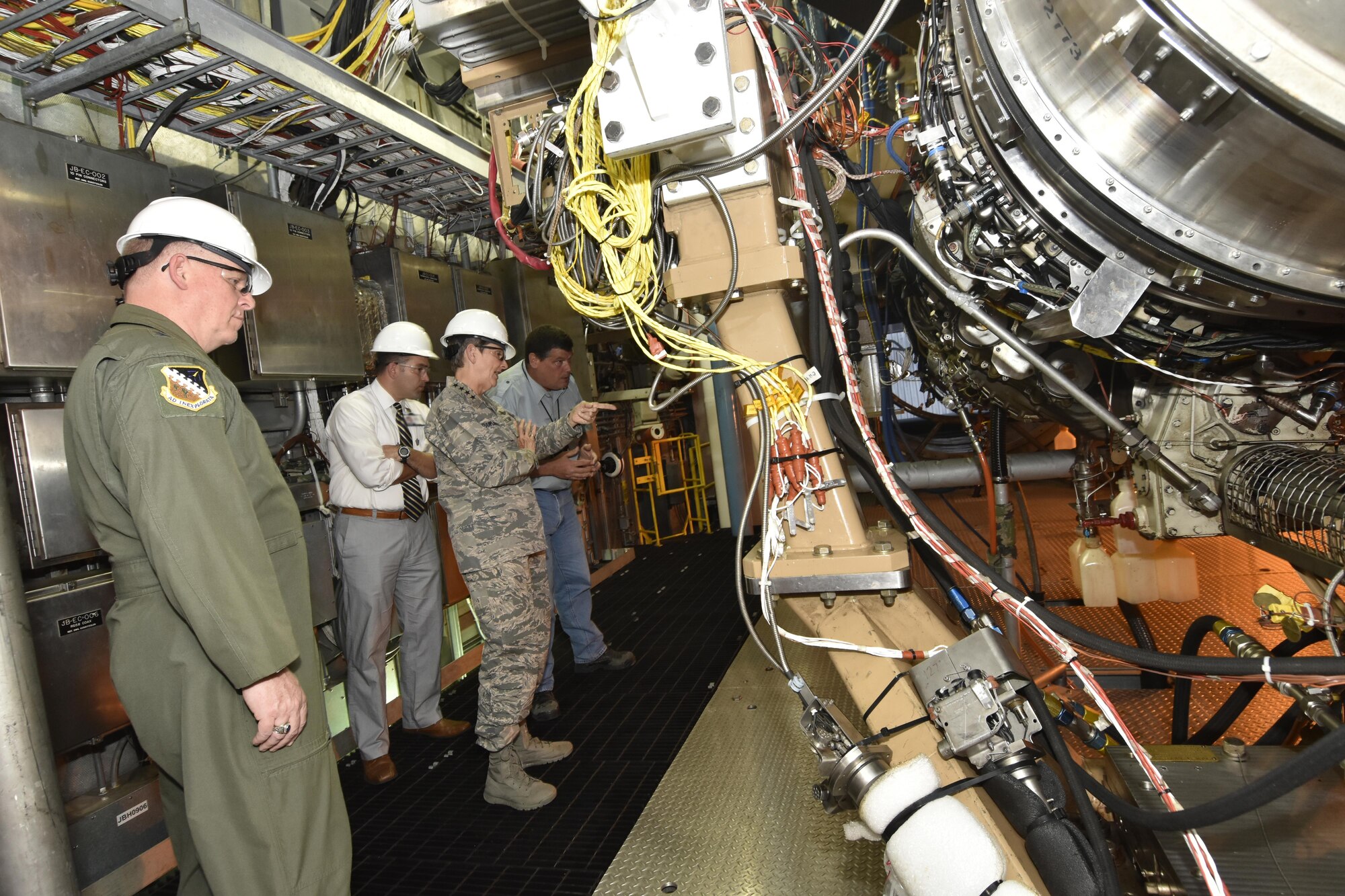 Gen. Ellen M. Pawlikowski, Air Force Materiel Command commander (center), and Maj. Gen. David Harris, Air Force Test Center commander (left), receive a briefing from AEDC staff members about an engine test facility Aug. 22, 2017. (U.S. Air Force photo/Rick Goodfriend) (This image was manipulated by obscuring badges for security purposes.)