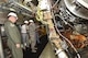 Gen. Ellen M. Pawlikowski, Air Force Materiel Command commander (center), and Maj. Gen. David Harris, Air Force Test Center commander (left), receive a briefing from AEDC staff members about an engine test facility Aug. 22, 2017. (U.S. Air Force photo/Rick Goodfriend) (This image was manipulated by obscuring badges for security purposes.)