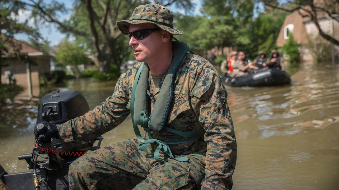 Marine Corps Sgt. Brad Coats, a reconnaissance Marine with Charlie Company, 4th Reconnaissance Battalion, 4th Marine Division, Marine Forces Reserve, steers a Marine Corps F470 Zodiacs Combat Rubber Raiding craft through a flooded street in Houston, Texas, Aug. 31, 2017. Hurricane Harvey landed Aug. 25, 2017, flooding thousands of homes and displaced over 30,000 people.