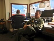 Col. Harry Hughes, a reservist assigned as Emergency Preparedness Liaison Officer to the Federal Emergency Management Agency-Region 8, listens to a Hurricane Harvey relief effort update at Joint Base San Antonio-Seguin Auxiliary Airfield Sept. 5, 2017.  Helping local response agencies coordinate with one another is a primary responsibility for EPLOs. (U.S. Air Force photo by Dan Hawkins)