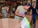 Capt. Latrina Dudley sorts through donated items at the San Antonio Food Bank warehouse Aug. 31. Dudley is the commander of the Training Support Activity at the U.S. Army Medical Department Center and School at Joint Base San Antonio-Fort Sam Houston.