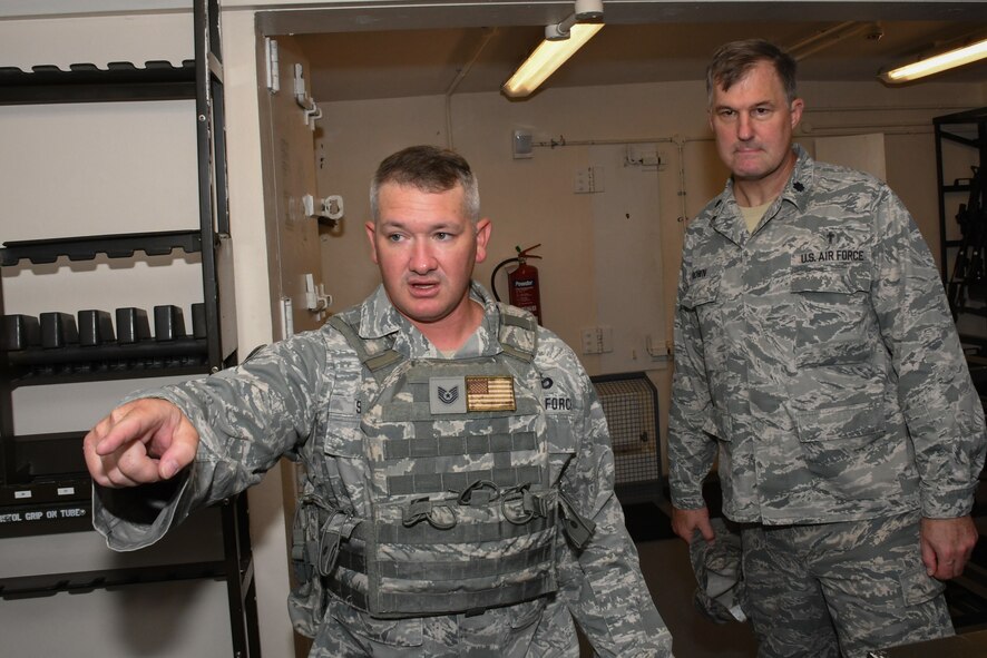 U.S. Air Force Tech. Sgt. Joseph Stevick, 307th Security Forces Squadron, shows Lt. Col. Kenneth Brown, 307th Bomb Wing chaplain, around the armory at Royal Air Force Fairford, United Kingdom, Aug. 28, 2017.