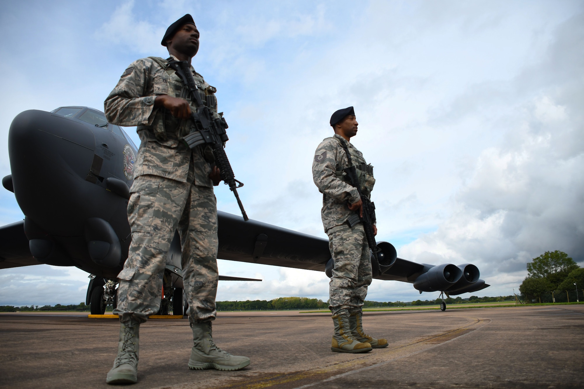 Airmen of the 307th Security Forces Squadron guard a B-52 Stratofortress at Royal Air Force Fairford, United Kingdom, Sep. 4, 2017.