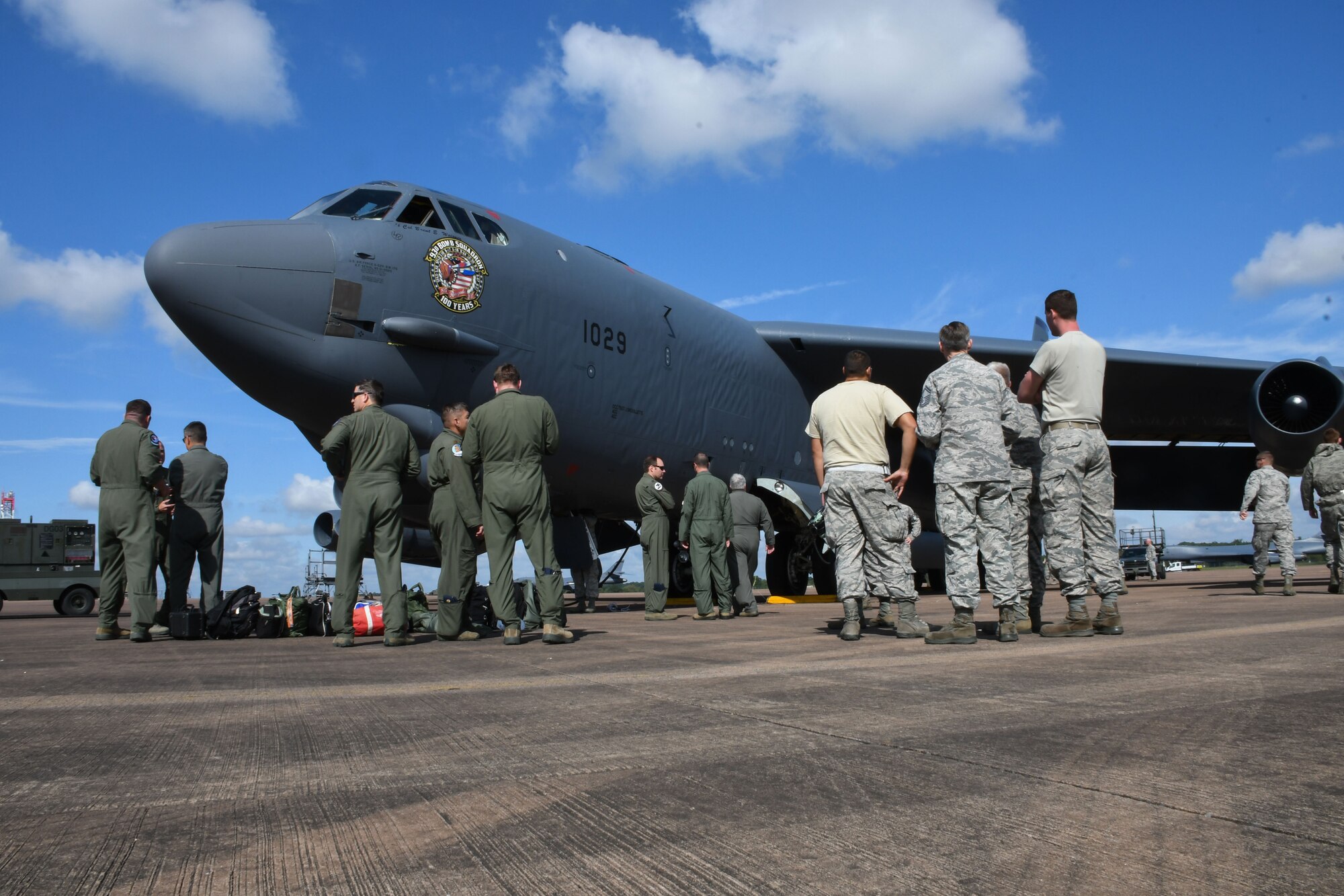 Airmen from the 307th Bomb Wing, 7th BW and 2nd BW gather around a recently arrived B-52 Stratofortress at Royal Air Force Fairford, United Kingdom, Sep. 1, 2017.