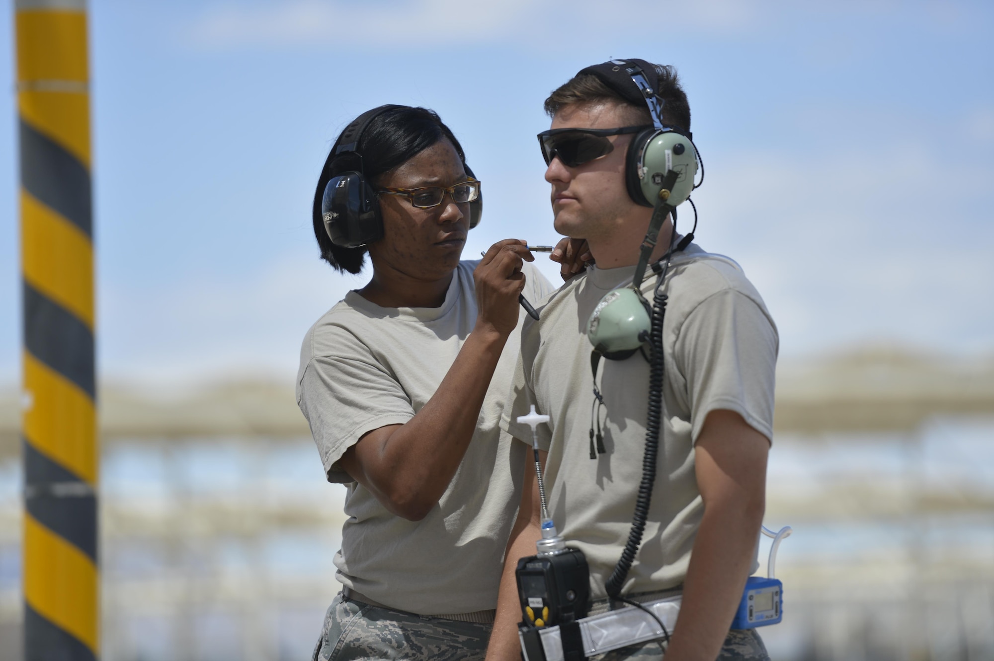 Airman Robert Briones, 62nd Fighter Squadron F-35 Crew Chief, has medical measurements taken from him while performing daily tasks Aug. 22, 2017 at Luke Air Force Base, Ariz. Briones was one of several Airmen who took part in an assessment on air quality and heat stress conducted by the USAF School of Aerospace Medicine. (U.S. Air Force photo/Airman 1st Class Caleb Worpel)