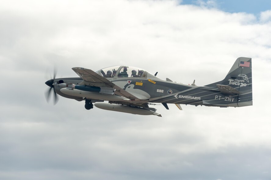 A Beechcraft AT-6 experimental aircraft flies over White Sands Missile Range, New Mexico, July 31. The AT-6 is participating in the U.S. Air Force Light Attack Experiment (OA-X), a series of trials to determine the feasibility of using light aircraft in attack roles. (U.S. Air Force photo by Ethan Wagner)