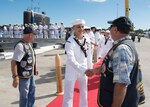 Retired submariners from the U.S. Submarine Veterans Bowfin Base chapter welcome home Sailors from the Los Angeles-class attack submarine USS Columbus (SSN 762). .(U.S. Navy Photo by Mass Communication Specialist 2nd Class Shaun Griffin/Released)