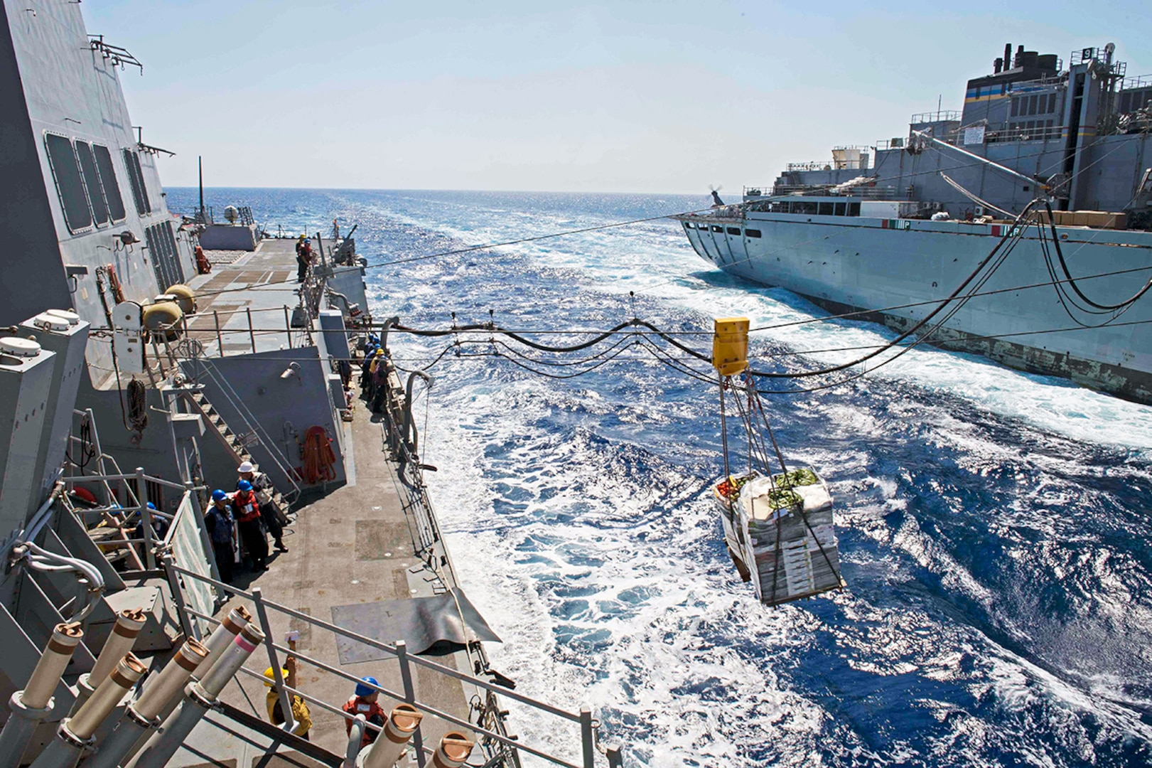 Food and fuel like these being transferred during a replenishment at sea on the African coast are among items DLA buys from African businesses to decrease customers’ storage costs and support the local economy.