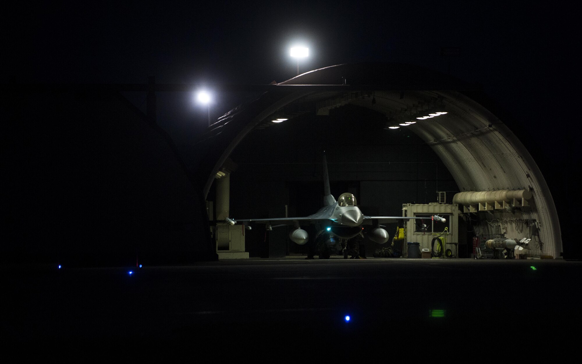 A U.S. Air Force F-16 Fighting Falcon sits parked in a hangar prior to pre-flight inspections at Kunsan Air Base, Republic of Korea, Aug. 23, 2017. Airmen assigned to the 8th Fighter Wing participated in Beverly Pack 17-3, a five-day, regularly-scheduled operational readiness exercise, which tested the base’s ability to respond to various scenarios in a contingency environment. (U.S. Air Force photo by Staff Sgt. Victoria H. Taylor/Released)