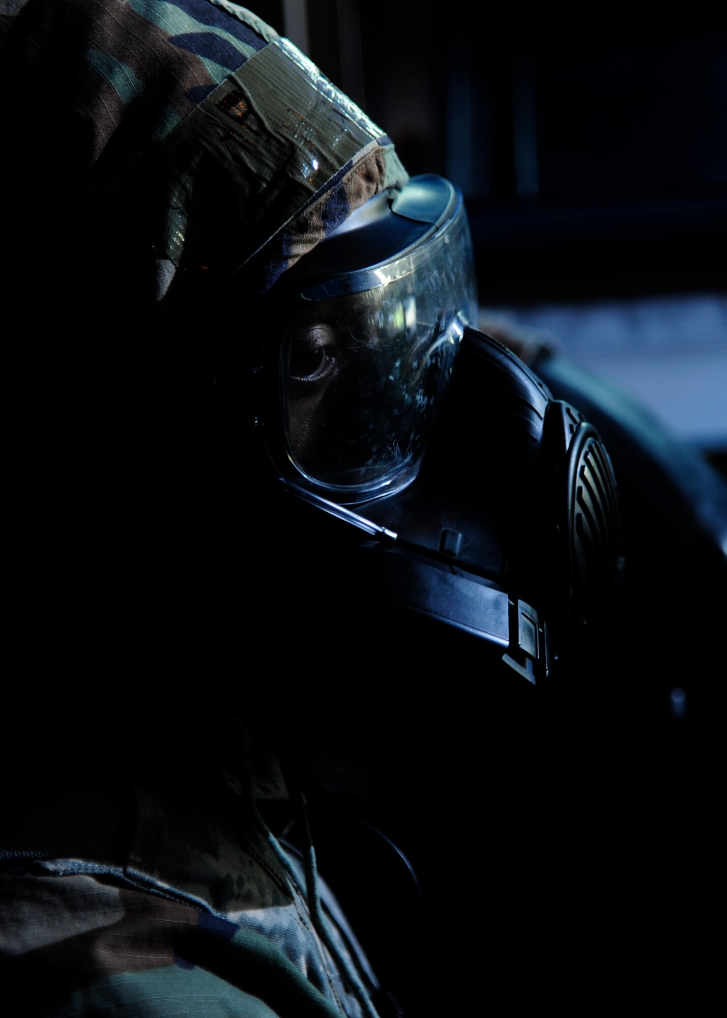 U.S. Air Force Senior Airman Trevin Taylor, 8th Operations Squadron air traffic controller, scans the airfield’s horizon wearing a Joint Service General Purpose M50 Mask as part of a regularly-scheduled operational readiness exercise, Beverly Pack 17-3, at Kunsan Air Base, Republic of Korea, Aug. 23, 2017. Air traffic control’s ability to carry out the duties of directing pilots in takeoff and landing, even in response to a chemical, biological, radiological or nuclear attack, plays a vital role in the 8th Fighter Wing’s abilities to defend the Korean peninsula. (U.S. Air Force photo by 2nd Lt Brittany Curry/Released)