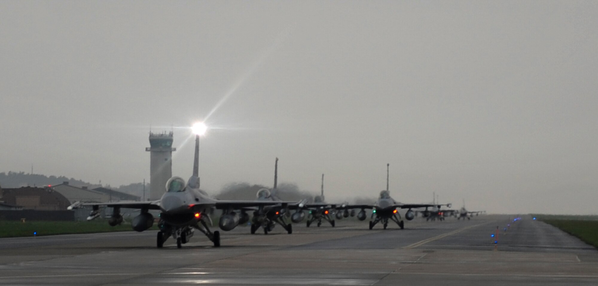 U.S. Air Force Fighting Falcon F-16s from the 8th Fighter Wing line up for an elephant walk at Kunsan Air Base, Republic of Korea, Aug. 22, 2017. The F-16 is a multi-role fighter aircraft, capable of close air support for ground forces and dominating enemy air assets in air-to-air combat. The elephant walk was a part of the regularly-scheduled operational readiness exercise, Beverly Pack 17-3, which tested the base’s ability to respond to various scenarios in a contingency environment. (U.S Air Force photo by Senior Airman Colville McFee/Released)