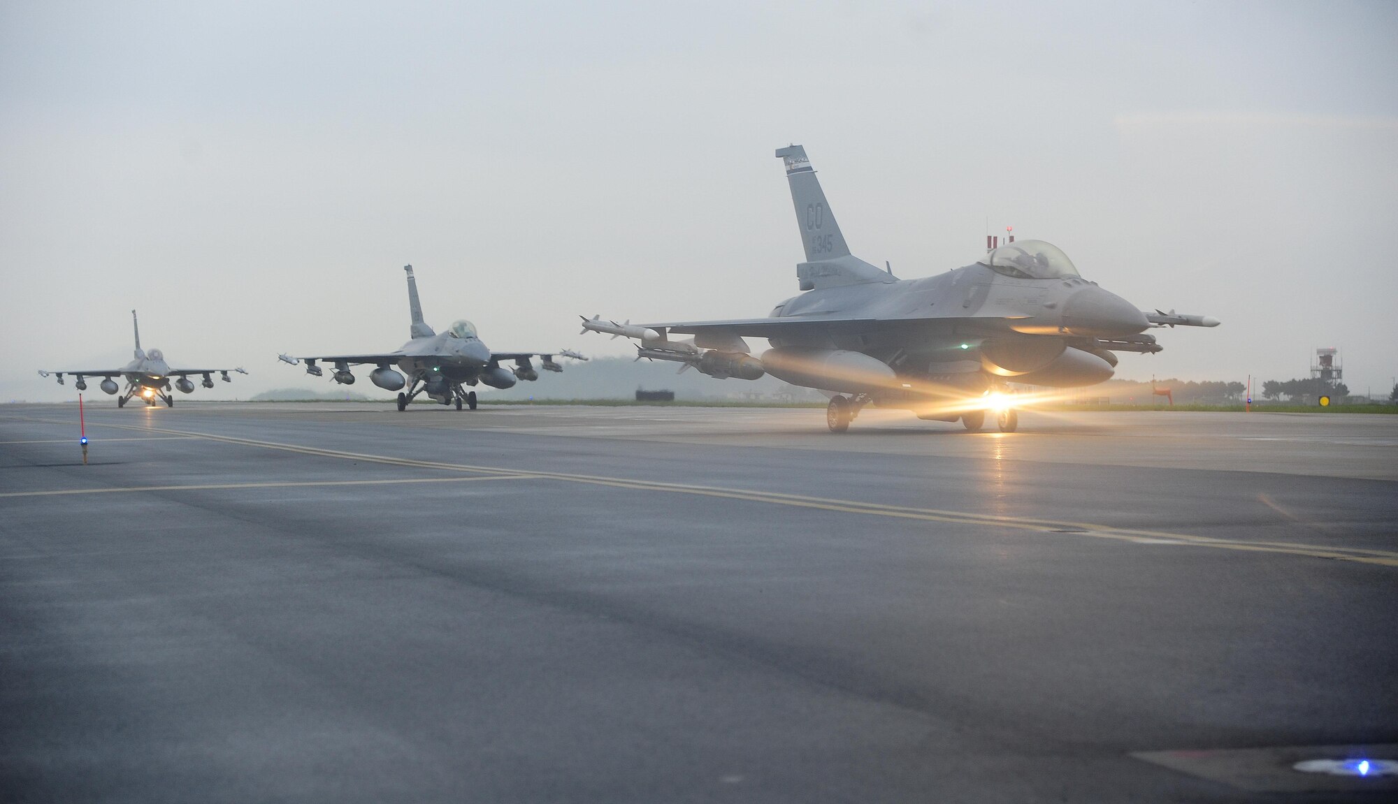 U.S. Air Force F-16 Fighting Falcons line up for an elephant walk at Kunsan Air Base, Republic of Korea, Aug. 22, 2017. The F-16 is a multi-role fighter aircraft, capable of close air support for ground forces and dominating enemy air assets in air-to-air combat. The elephant walk was a part of a regularly-scheduled operational readiness exercise, Beverly Pack 17-3, which tested the base’s ability to respond to various scenarios in a contingency environment.  (U.S. Air Force photo by Senior Airman Colby L. Hardin/Released)