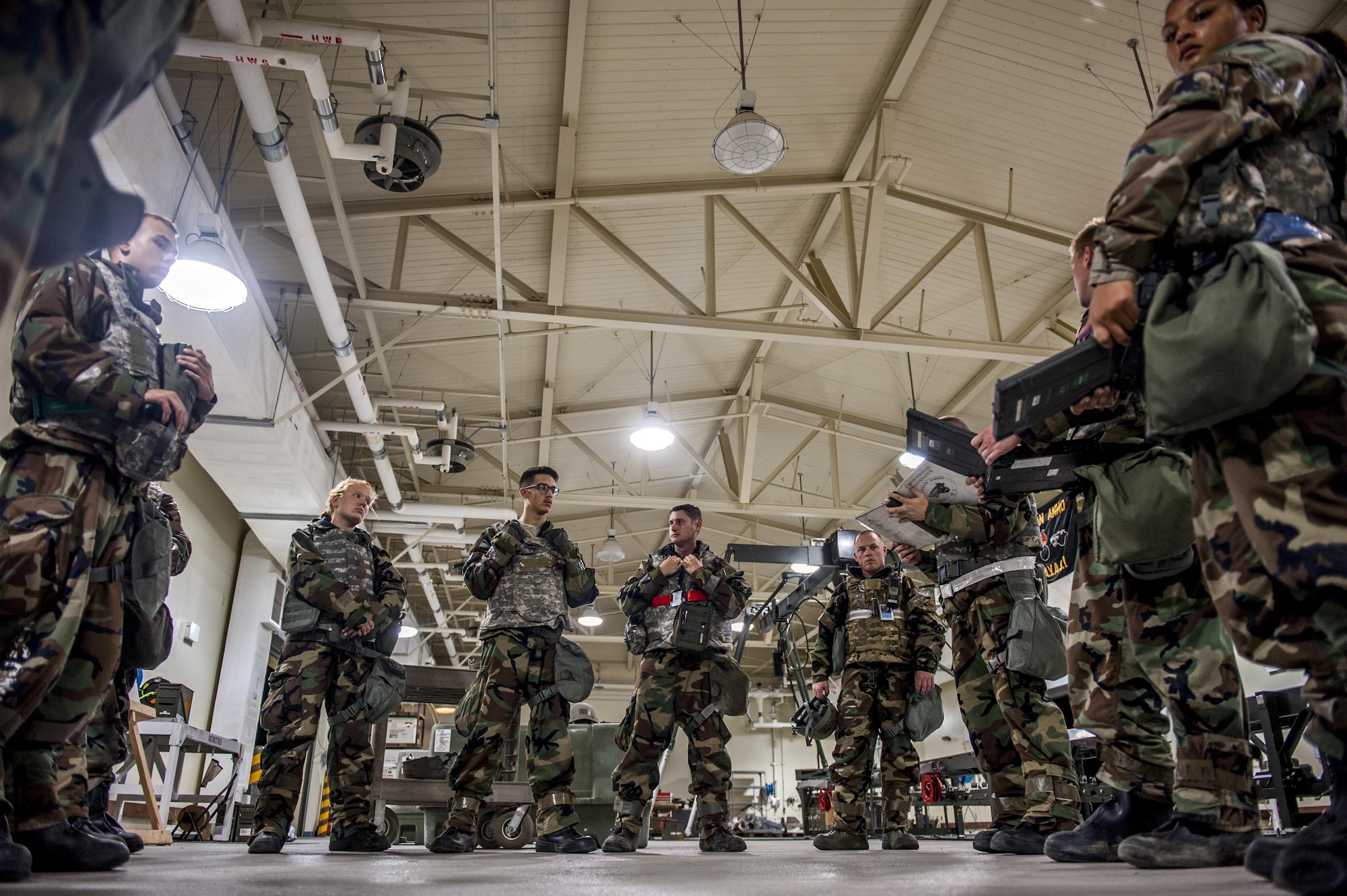 U.S. Air Force Airmen assigned to the 8th Munitions Squadron receive a safety briefing prior to assembling bombs as a part of a regularly-scheduled operational readiness exercise, Beverly Pack 17-3, at Kunsan Air Base, Republic of Korea. Aug. 22, 2017.