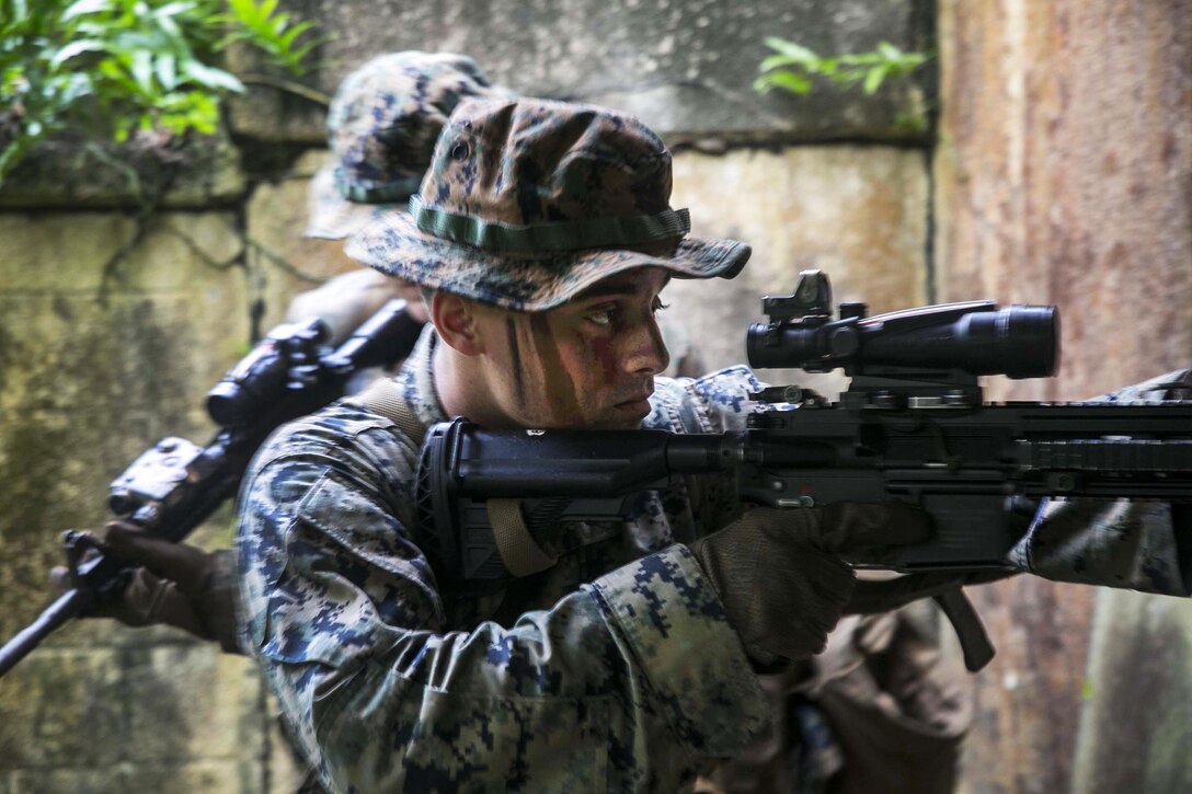 Lance Cpl. Shaun Chamberlin prepares to clear a room during military operations in urbanized terrain training