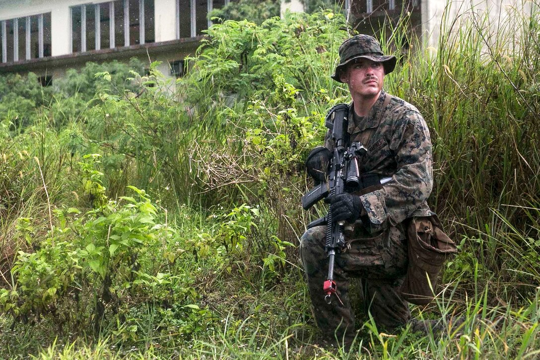 Cpl. Floyd R. Tidwell provides security for the rest of his team during military operations in urbanized terrain training