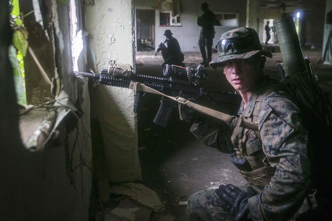 Lance Cpl. Cody L. Jowers provides security after his team cleared an abandoned house