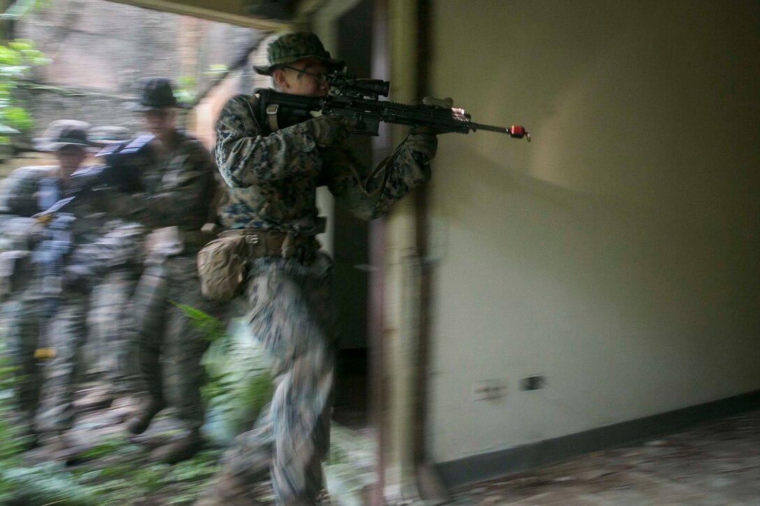 Marines with Battalion Landing Team, 3rd Battalion, 5th Marines, conduct Military Operations in Urbanized Terrain (MOUT) training at Andersen South Air Force Base, Guam, August 30, 2017