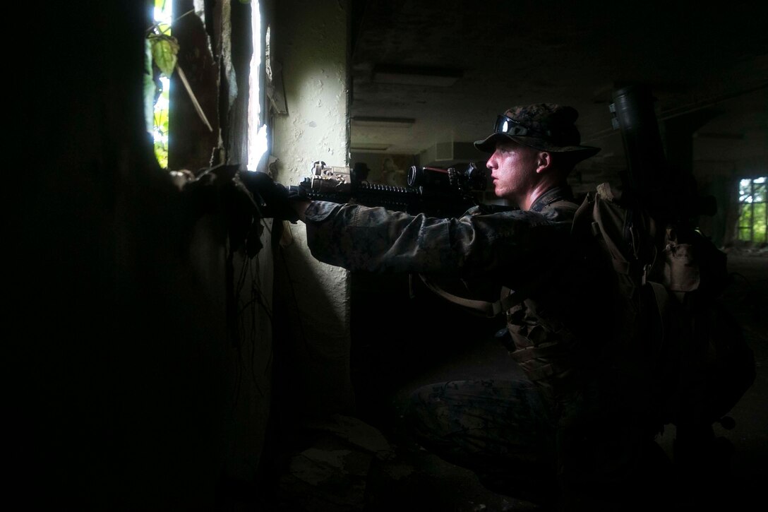 Marines with Battalion Landing Team, 3rd Battalion, 5th Marines, conduct Military Operations in Urbanized Terrain (MOUT) training at Andersen South Air Force Base, Guam, August 30, 2017