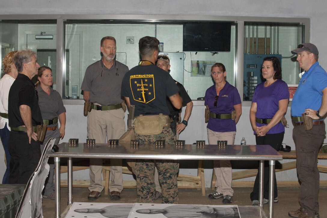 U. S. Special Operations Command’s Special Operations Forces Civilian Leadership Development Program (SOF CLDP) visited U.S. Marine Corps Forces, Special Operations Command on Marine Corps Base Camp Lejeune, N.C., June 5th through 7th, 2017.  Participants fired SOF-specific service pistols at MARSOC’s indoor range after receiving firearms safety briefs from Marine Raiders. (U.S. Marine Corps photo by Lance Cpl. Bryann Whitley, released)