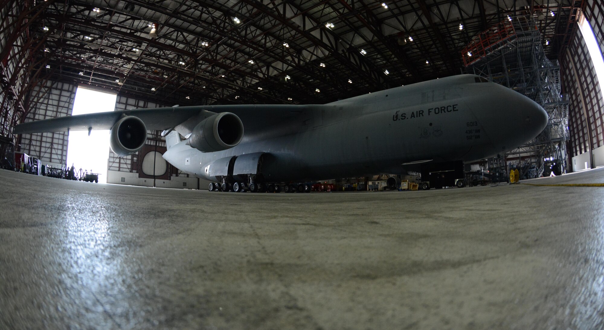 A Dover C-5M Super Galaxy recieves repairs to its nose gear August 23, 2017, in the Isochronal Maintenance Dock at Westover Air Reserve Base, Massachusetts. The ISO Dock at Westover is the only minor ISO Dock for C-5 aircraft in the Air Force. (U.S. Air Force photo by Airman Hanna N. Smith)