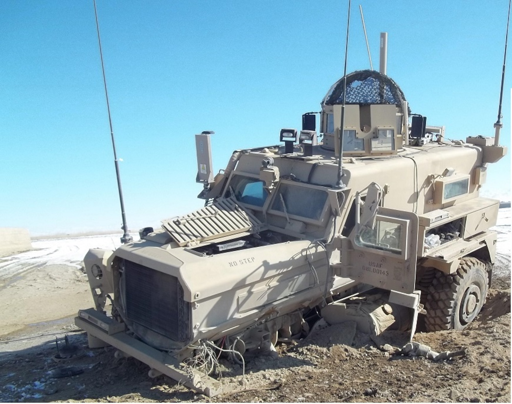 The broke-down vehicle of U.S. Air Force Staff Sgt. Timothy Donnan, 633rd Civil Engineer Squadron Explosives Ordnance Disposal team lead, sits after it was hit by an Improvised Explosive Device in Afghanistan, Jan. 16, 2012. (courtesy photo)
