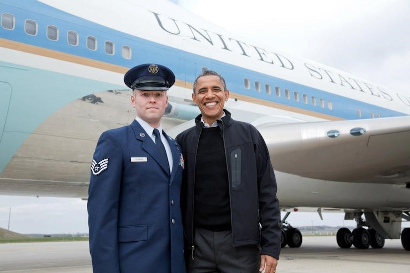 U.S. Air Force Staff Sgt. Timothy Donnan, 633rd Civil Engineer Squadron Explosives Ordnance Disposal team lead, poses with former President Barak Obama. (courtesy photo)