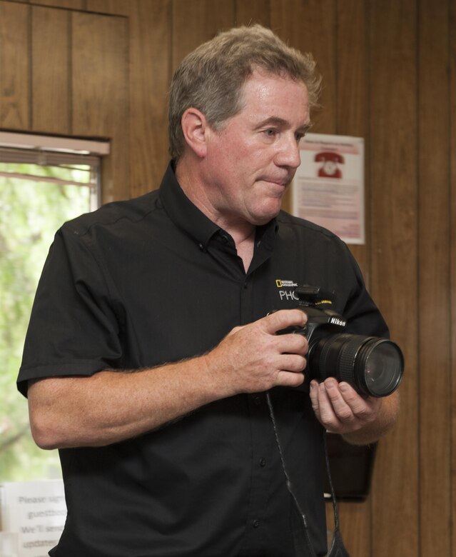 Joel Sartore, a photographer for National Geographic, visits the California Raptor Center, University of California, Davis, to document a white-tailed kite, a new species of raptor, for the Photo Ark Project, Aug. 17, 2017.  Satore specializes in documenting endangered species and landscapes around the world. He is the founder of the Photo Ark, a 25-year documentary project to save species and habitat. (U.S. Air Force photo by Heide Couch)