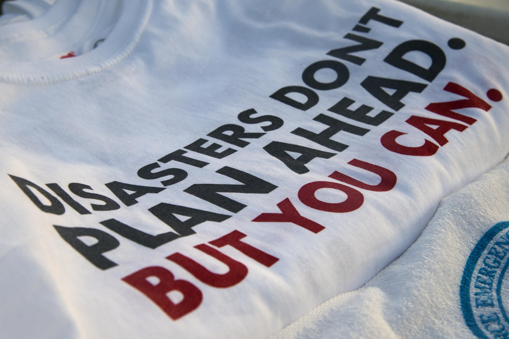 A t-shirt awarded to the top finishers of the National Preparedness Month 5k fun run rests on a table, Sept. 1, 2017, at Moody Air Force Base, Ga. National Preparedness is designed to educate and empower not only the base, but also the community on preparing for any disaster. (U.S. Air Force photo by Airman 1st Class Erick Requadt)