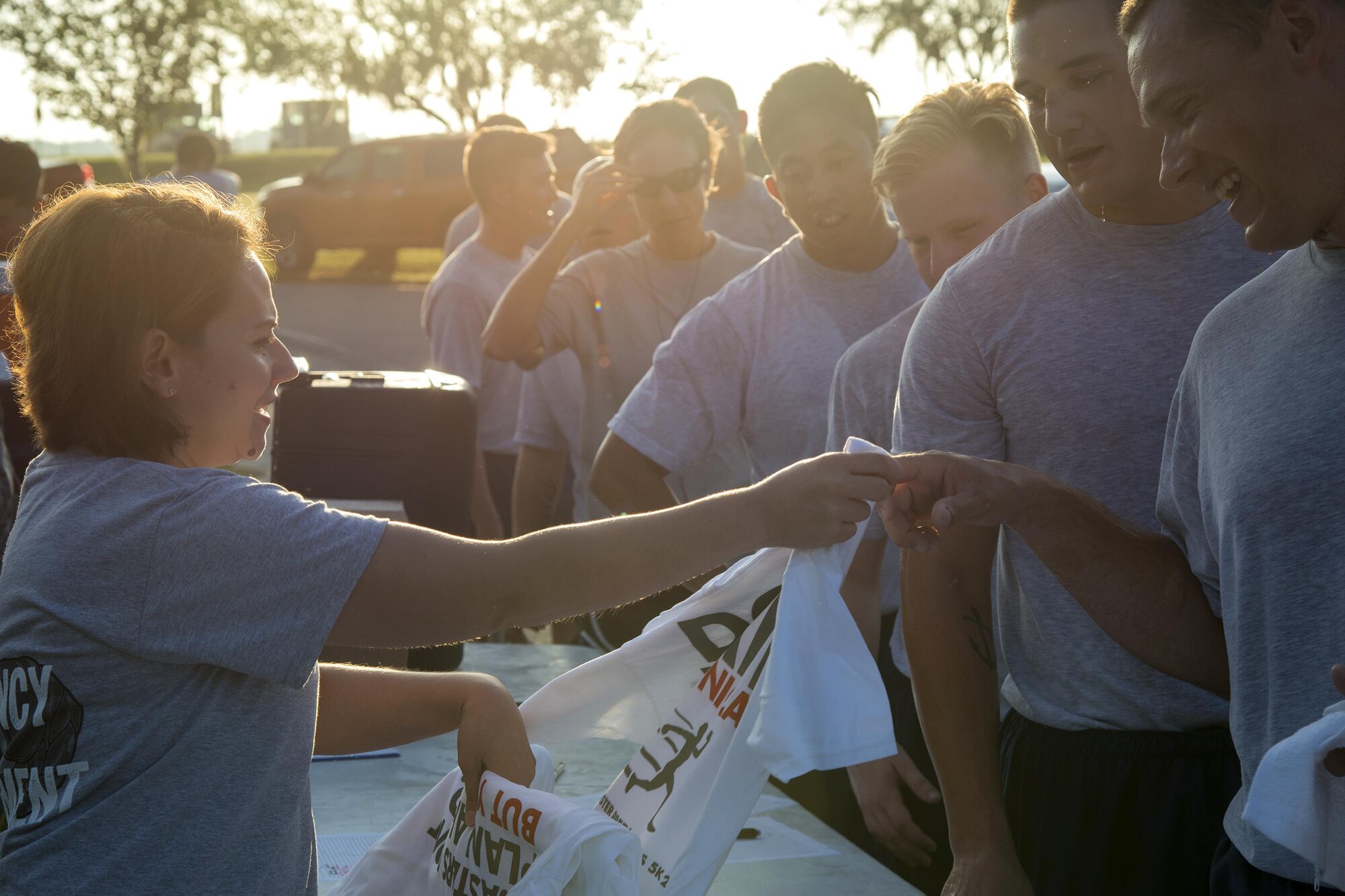 Master Sgt. Terri Adams, 23d Civil Engineer Squadron emergency management section chief, awards top finishers their t-shirts during the National Preparedness Month 5k fun run, Sept. 1, 2017, at Moody Air Force Base, Ga. National Preparedness Month is designed to educate and empower not only the base, but also the community on preparing for any disaster. (U.S. Air Force photo by Airman 1st Class Erick Requadt)