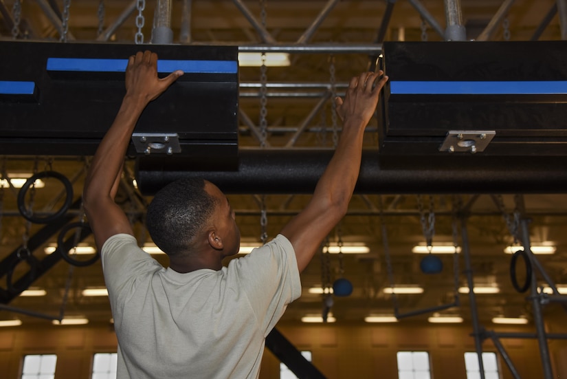 U.S. Air Force Airman 1st Class Damaun Webster, 633rd Force Support Squadron fitness specialist, demonstrates how to properly use the Battle Rig at Joint Base Langley-Eustis, Va., Aug. 29, 2017.