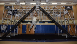 U.S. Air Force Airman 1st Class Damaun Webster, 633rd Force Support Squadron fitness specialist, climbs the devil steps on Battle Rig at Joint Base Langley-Eustis, Va., Aug. 29, 2017.