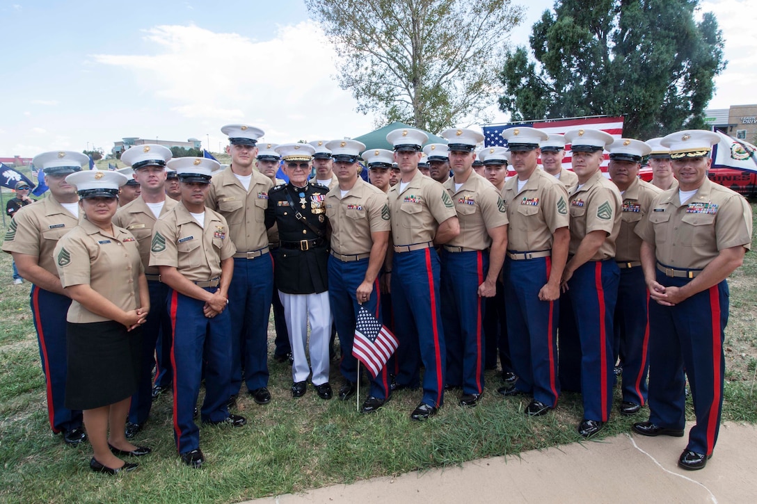 Marines with Recruiting Station Denver stand with retired Maj. Gen. James Livingston, Vietnam War veteran and Medal of Honor recipient, at the Marine Corps Memorial in Golden, CO on Aug. 26, 2017. a time capsule set for 100 years was deposited in the base of the Memorial. The capsule contents commemorate the United States Bicentennial, the State of Colorado Centennial and the 201st birthday of the United States Marine Corps.
