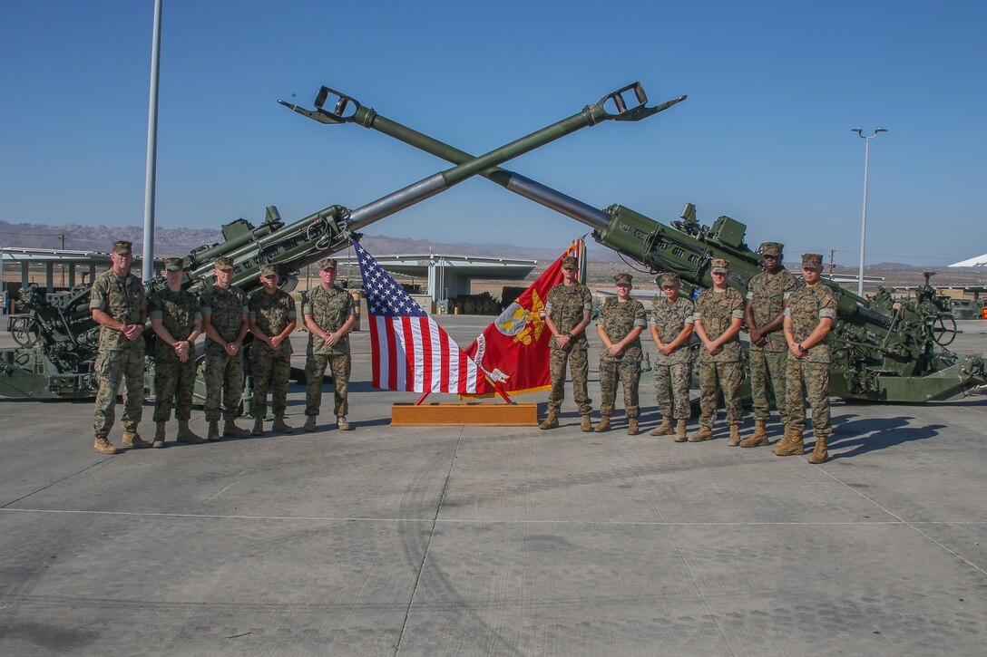 U.S. Marines with 3rd Battalion, 11th Marines, pose for a group photo during a mass reenlistment ceremony aboard the Marine Corps Air Ground Combat Center, Twentynine Palms, Calif., Aug 24, 2017.