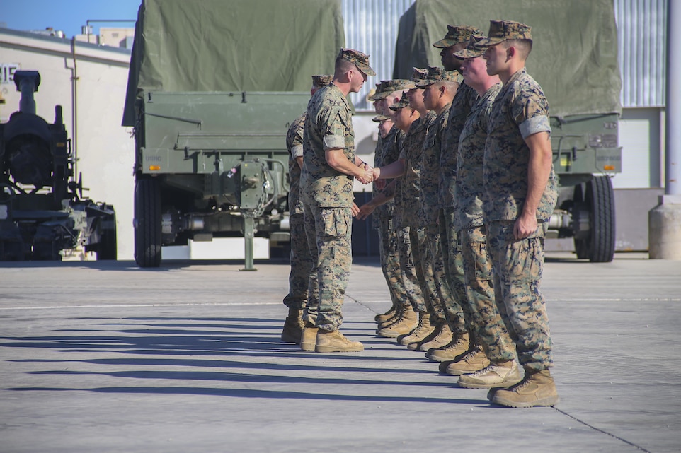 U.S. Marine Corps Lt. Col. Robert G. McCarthy, Commanding Officer, 3rd Battalion, 11th Marines,  congratulates Marines during a mass reenlistment ceremony aboard the Marine Corps Air Ground Combat Center, Twentynine Palms, Calif., Aug 24, 2017.